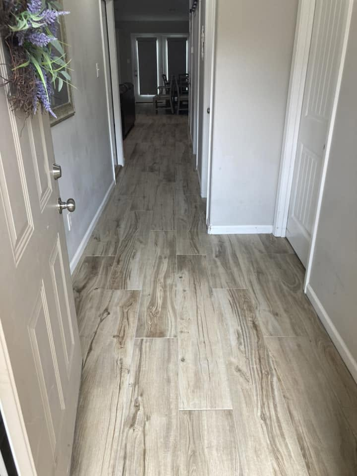 Hallway finished with wood-look tile plank flooring